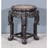 A Chinese Carved Rosewood Octagonal Jardiniere Stand, the top inset with red veined marble, the