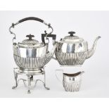 An Edward VII Silver Oval Kettle on Stand and Similar Oval Teapot and Milk Jug, the kettle on