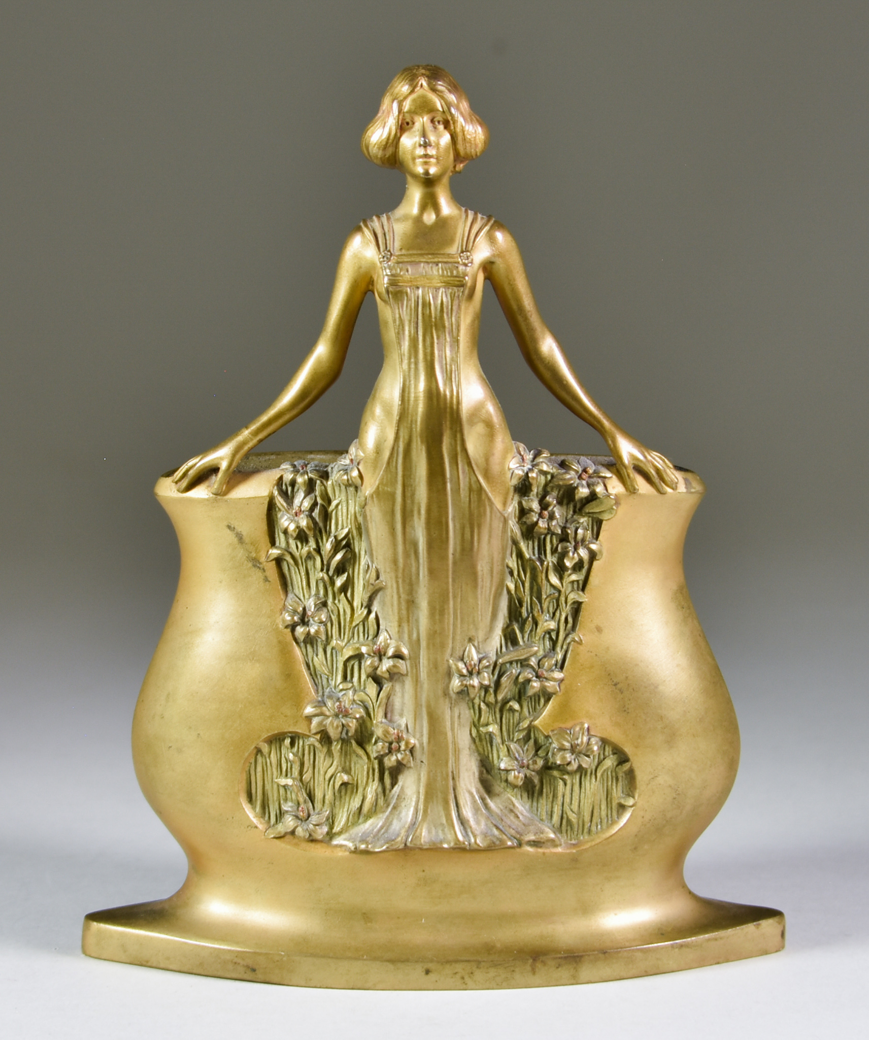 Charles Korschann (1872-1943) - Gilt bronze vase modelled as a standing girl amongst irises,