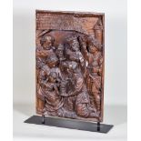 A Low Countries Carved Walnut Panel of the Adoration of the Magi, c.1500, the three kings shown in