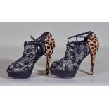 A Pair of Stiletto Heeled Shoes by Christian Louboutin, model "Black/Brown Leopard Pony Hair and