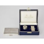A George V Silver and Silver Gilt Rectangular Card Case and an Elizabeth II Silver Sovereign Case