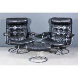 A Pair of Norwegian Stressless Easy Chairs and a Matching Stool, upholstered in black leather and
