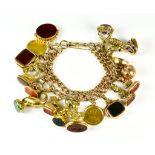 A 9ct Gold Charm Bracelet, 20th Century, suspended with eighteen charms, various, including one half