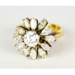 A Diamond Flower Head Ring, 20th Century, centre brilliant cut white diamond, approximately .75ct,