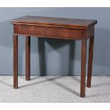 A George III Mahogany Rectangular Tea Table, the plain folding top with moulded edge, deep frieze on