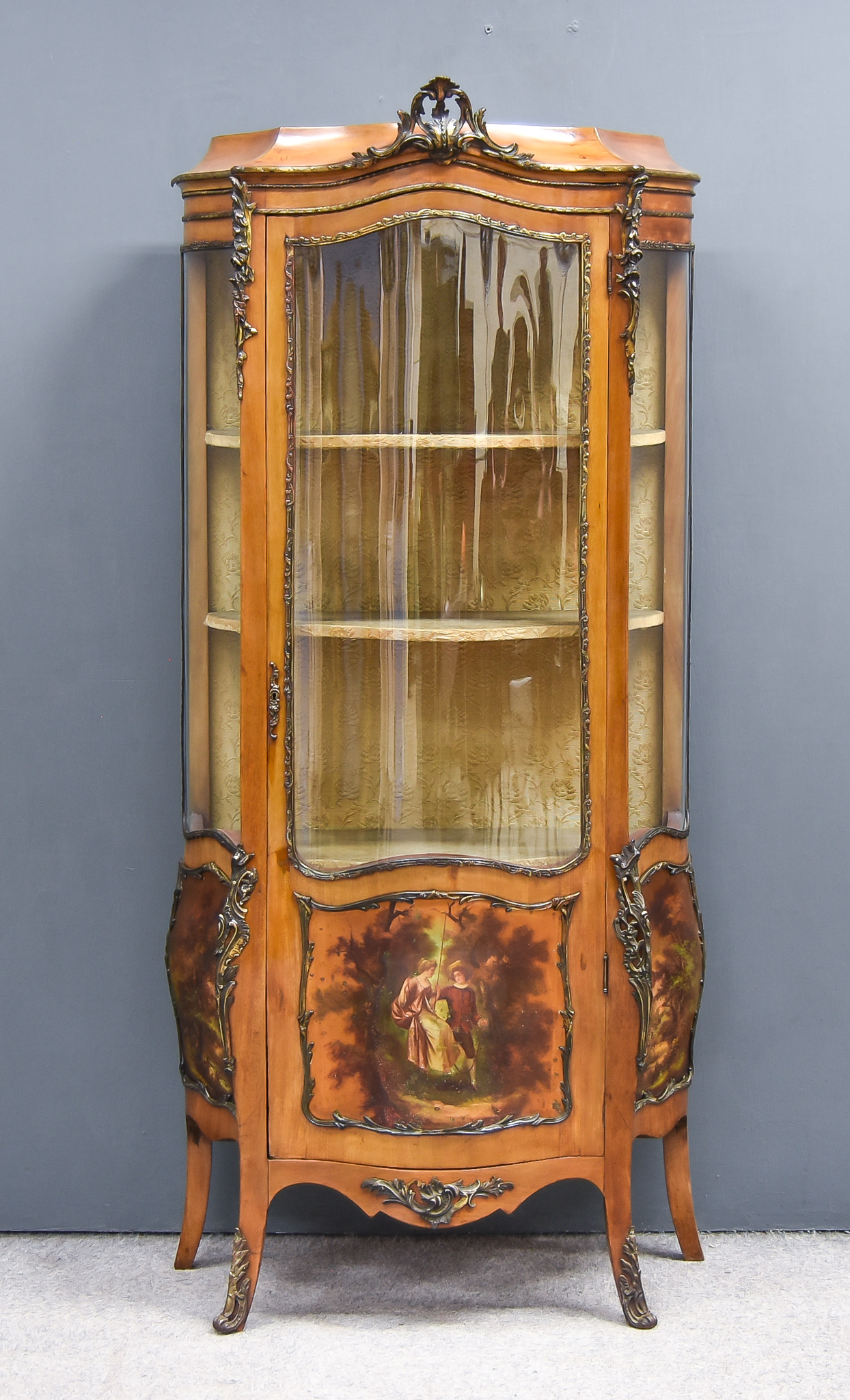 A 19th Century French Mahogany and Gilt Metal Mounted Vitrine of Shaped Outline, with pierced