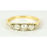 A Five Stone Diamond Ring, Modern, in 18ct gold mount, set with round brilliant cut diamonds of