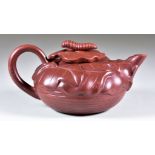 A Chinese Yixing Teapot and Cover, the body moulded with leaves, the cover with a caterpillar,