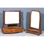 A George III Figured Mahogany Toilet Mirror, on turned uprights, the bow front base inlaid with