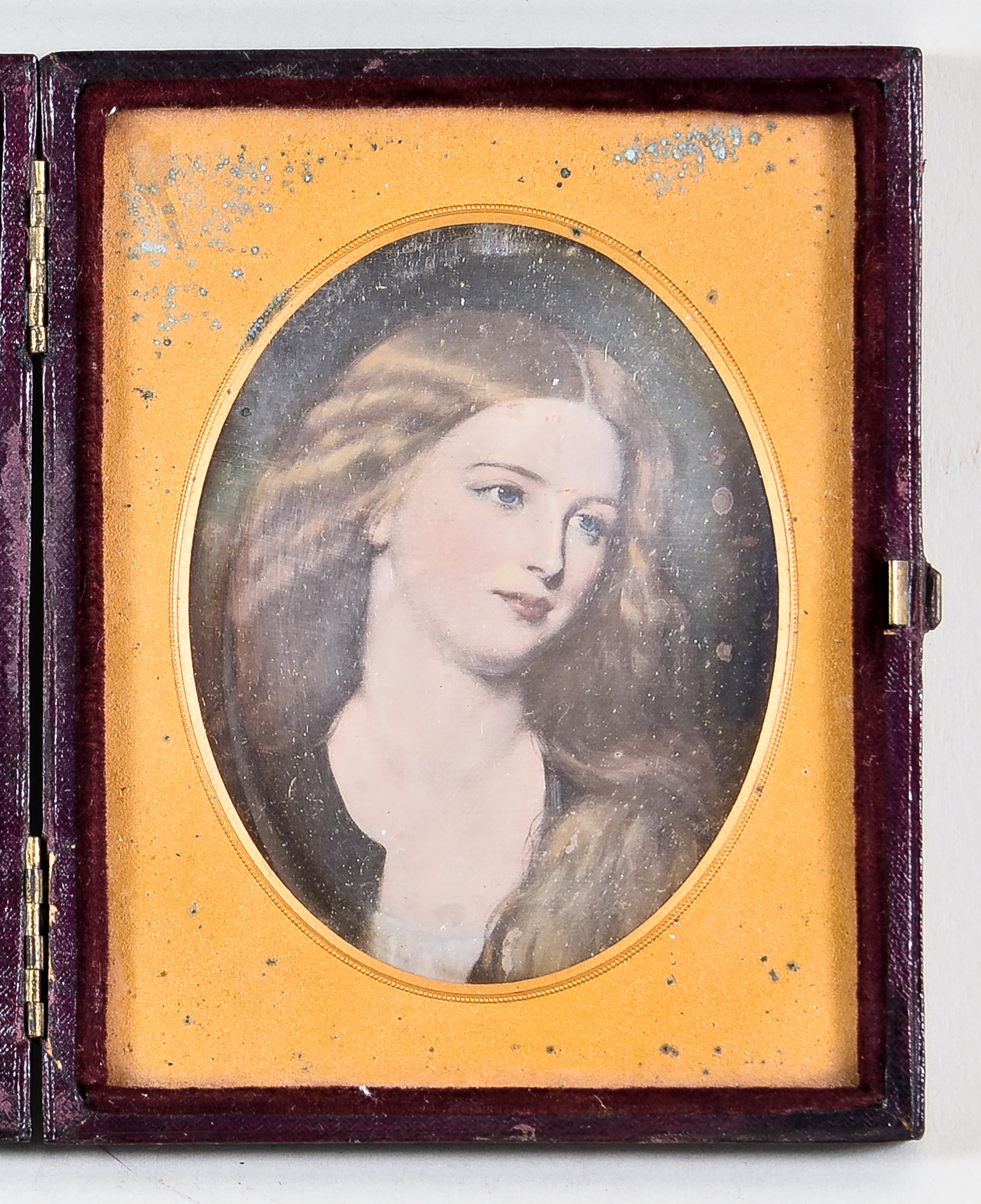 A Tinted Miniature Shoulder Length Portrait Photograph, Mid-19th Century, of a young woman, oval 3.