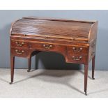 A George III Mahogany Cylindrical Kneehole Desk, the tambour front enclosing pigeon holes and