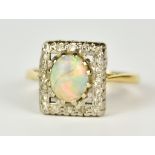 An 18ct Gold and Platinum Opal and Diamond Ring, Modern, centre opal, 10mm x7mm, surrounded by