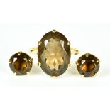 A 9ct Gold Smokey Quartz Dress Ring and Earings, 20th Century, set with a large faceted smokey