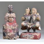 A Chinese Painted Carved Wood Standing Figure of a Pair of Twins, on rectangular base, 8.25ins (