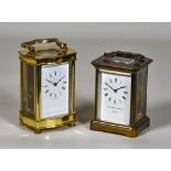 Two Early 20th Century Carriage Timepieces, one by Matthew Norman of London, the white enamel dial