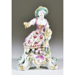 A Bow Figure Emblematic of Summer, Circa 1760, modelled as a seated lady holding a sheaf of corn, on
