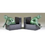 Early 20th Century Continental School - Pair of green bronzed metal and polished marble bookends,