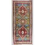 An Early 20th Century Sarab Runner, woven in colours with three lozenge shaped medallions filled
