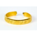 A 22ct Gold Wedding Band, (cut), gross weight 3.5g