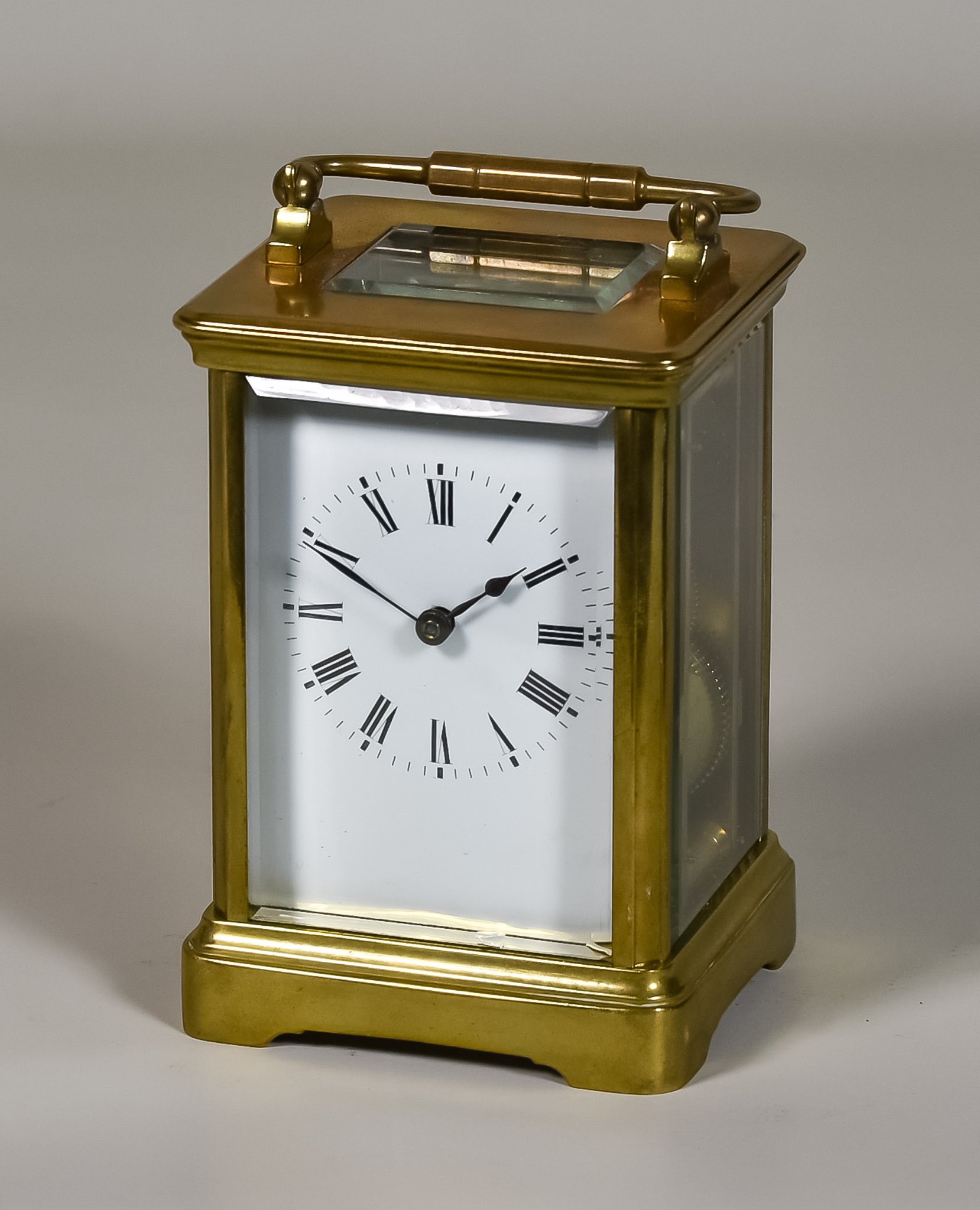 A Late 19th Century French Carriage Clock, the white enamel dial with Roman numerals to the eight