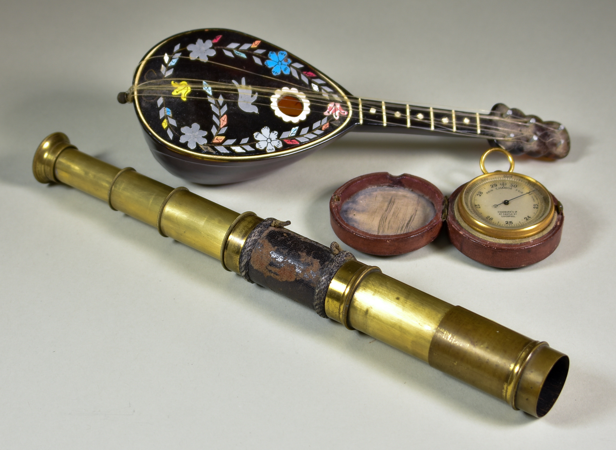 A Pocket Barometer by Chadburn's Ltd of Liverpool, with silvered scale and brass drum pattern