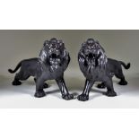 A Pair of Japanese Bronze Figures of Walking Lions, 20th Century, with glass eyes and rectangular