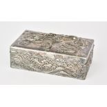 A Chinese Silvery Metal and Hardwood Rectangular Cigarette Box, the lid embossed with dragon, the