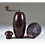 A Lignum Vitae Pepper Mill, Late 18th/Early 19th Century, 5.25ins high, and a polished nut of animal