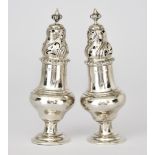 A Pair of Edward VII Silver Sugar Casters, by Elkington & Co., Birmingham 1909, the shaped covers