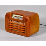 A Sentinel L284 Catalin Radio, Serial No.11630, in amber Bakelite case, grille and knobs, 11.