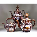 A Treacle-Glaze Barge Ware Teapot, Cover and Stand, typically decorated with stamps of flowers and