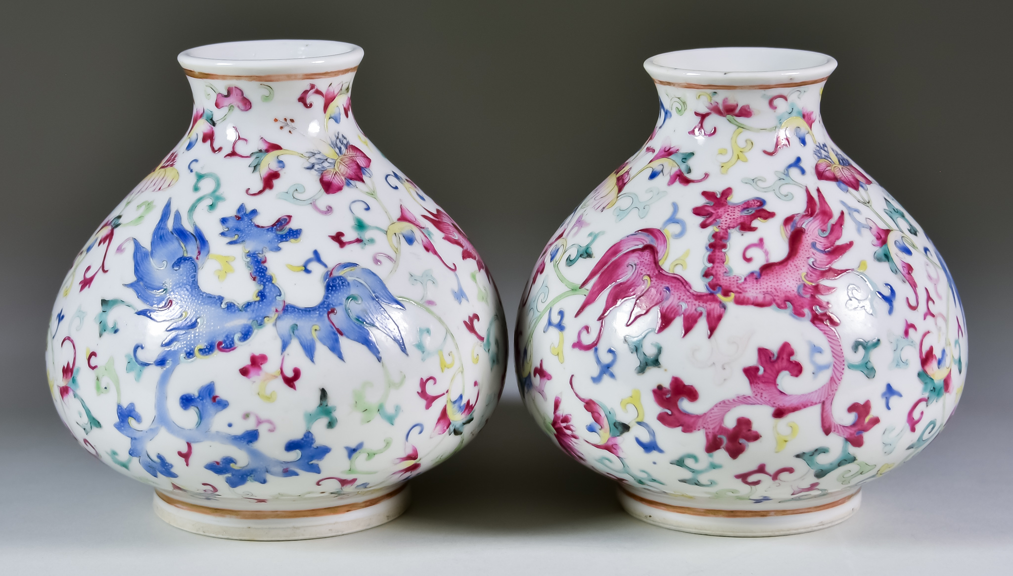 A Pair of Chinese Porcelain Vases of Squat Form, 19th Century, enamelled in a famille rose palette