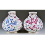 A Pair of Chinese Porcelain Vases of Squat Form, 19th Century, enamelled in a famille rose palette