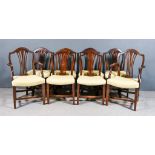 A Set of Eight Mahogany Dining Chairs of Hepplewhie Design, including two armchairs, the shield
