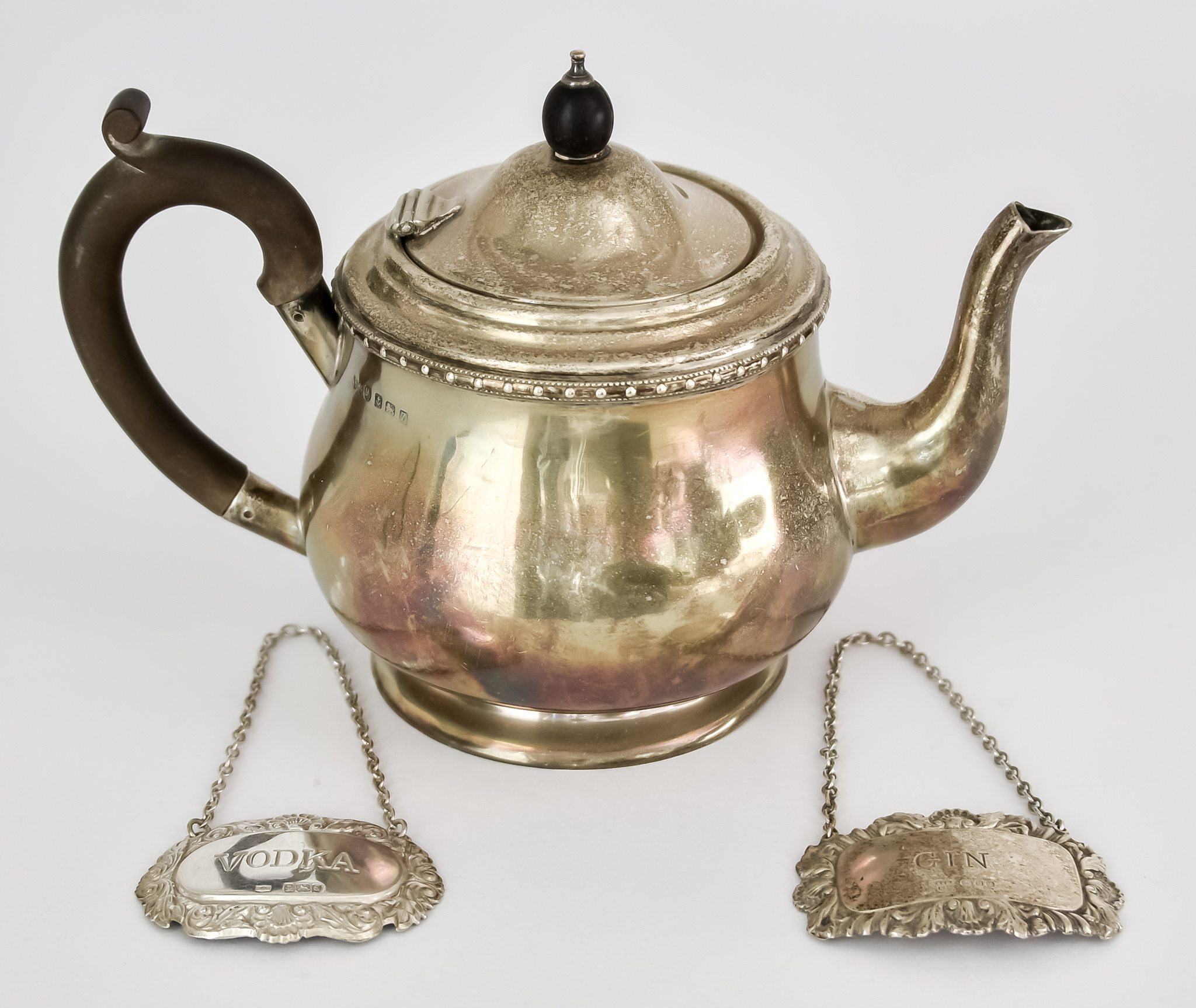 A George V Silver Bachelors Teapot, by Hukin & Heath Ltd., Birmingham 1924, of circular bulbous