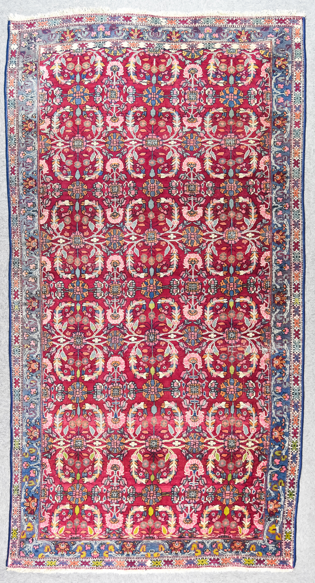 A 19th Century Bidjar Carpet, woven in colours of ivory, navy blue and wine, the field filled with