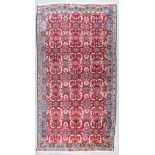 A 19th Century Bidjar Carpet, woven in colours of ivory, navy blue and wine, the field filled with