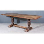 An Old Oak Refectory Table of "17th Century" Design, the cleated four plank top on turned supports