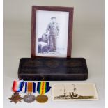 A 1914-18 War Medal, a 1914-18 Peace Medal, and a 1914-18 Star to K26039 W. J. Martin STO.1.RN, in