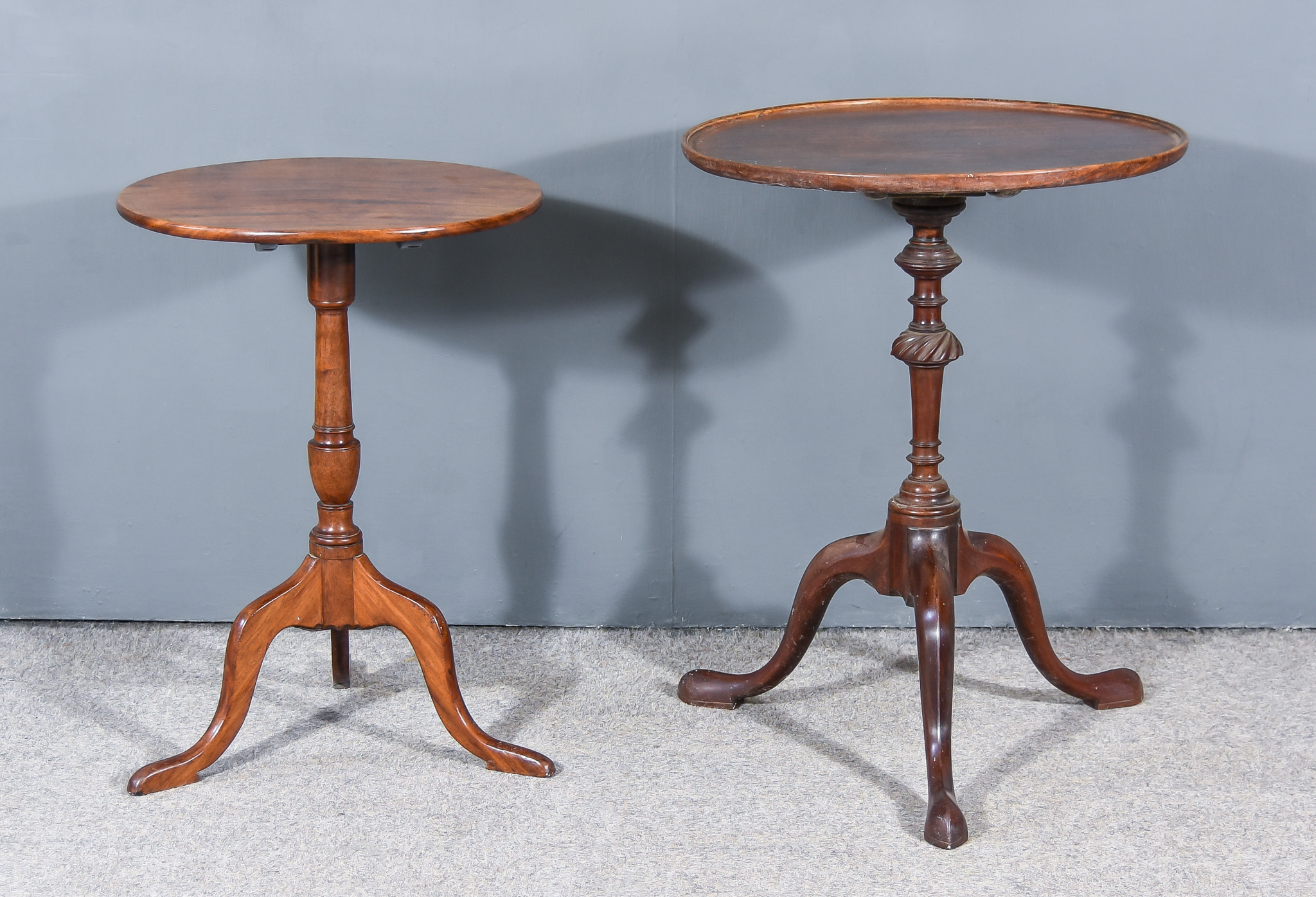 Two George III Mahogany Circular Tripod Occasional Tables, one with moulded edge to top on turned