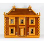 A Modern Stained Wood Double Fronted Dolls' House, 32ins x 14.5ins x 31ins high, complete with