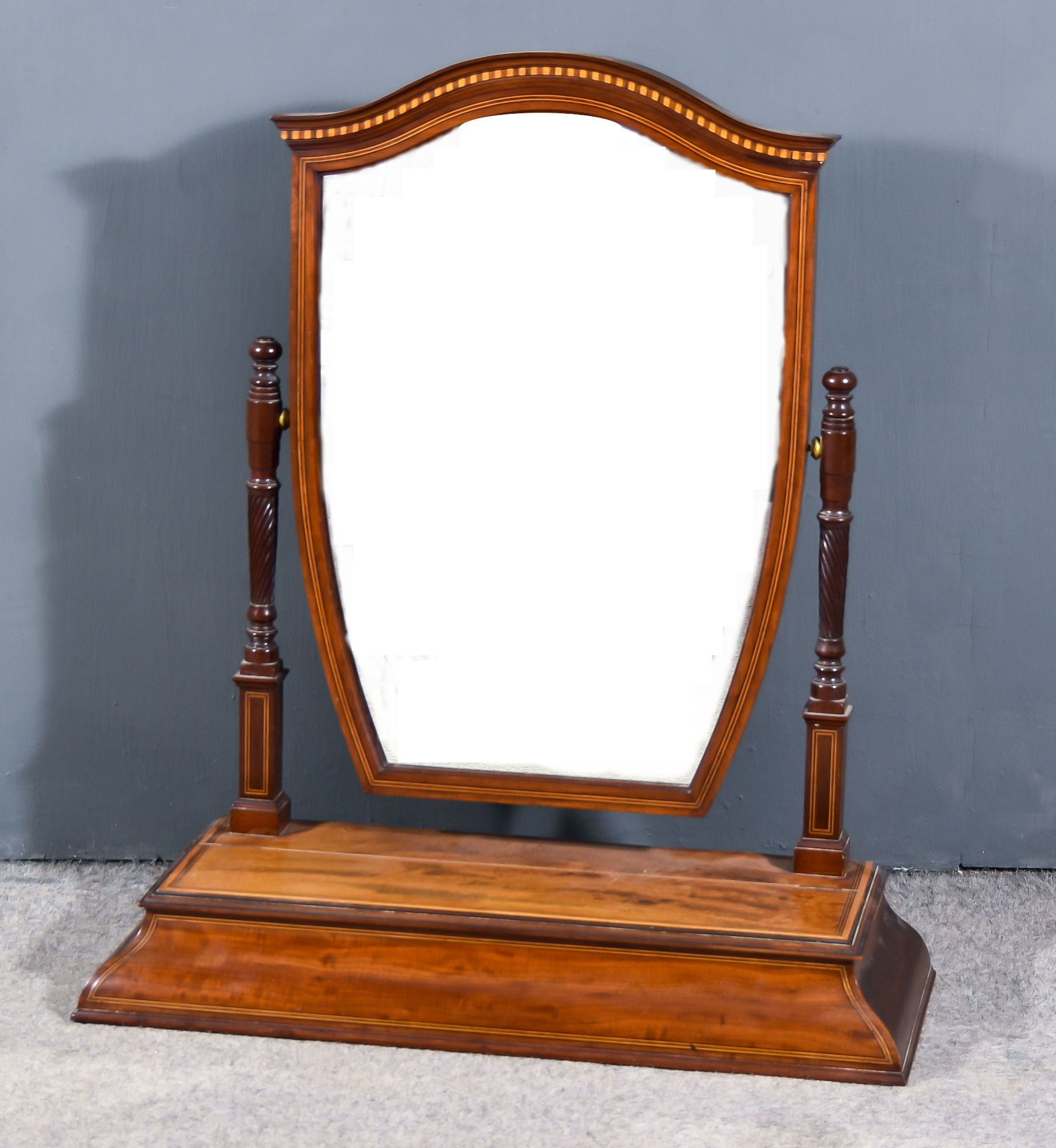 A Edwardian Mahogany Framed Shield Shape Toilet Mirror, inlaid with stringings and bandings, with