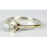 An 18ct White Gold Solitaire Diamond Ring, Modern, set with an oval diamond, approximately .50ct,