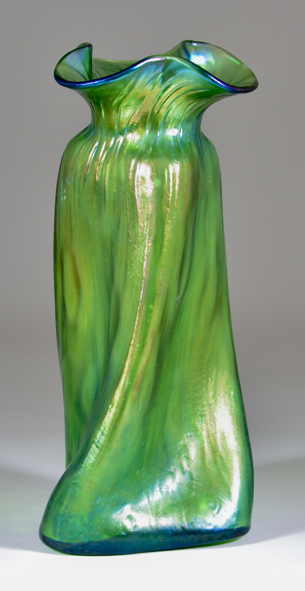 A Loetz Green Iridescent Glass Propeller Vase, of twisted triangular section, 9.75ins high