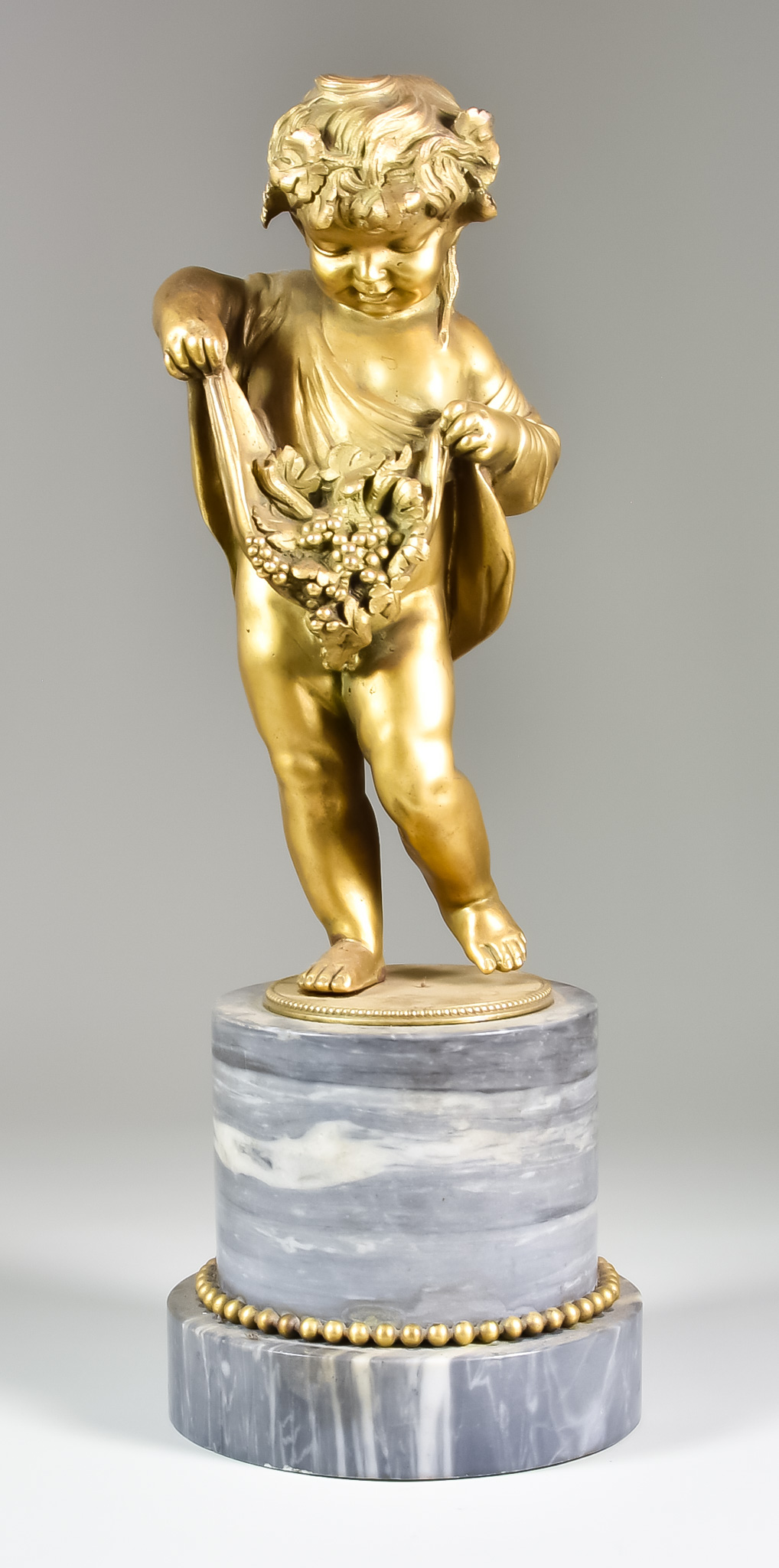 An Early 20th Century School - Gilt Metal Standing Figure of a Bacchanalian Putto, on a grey flecked