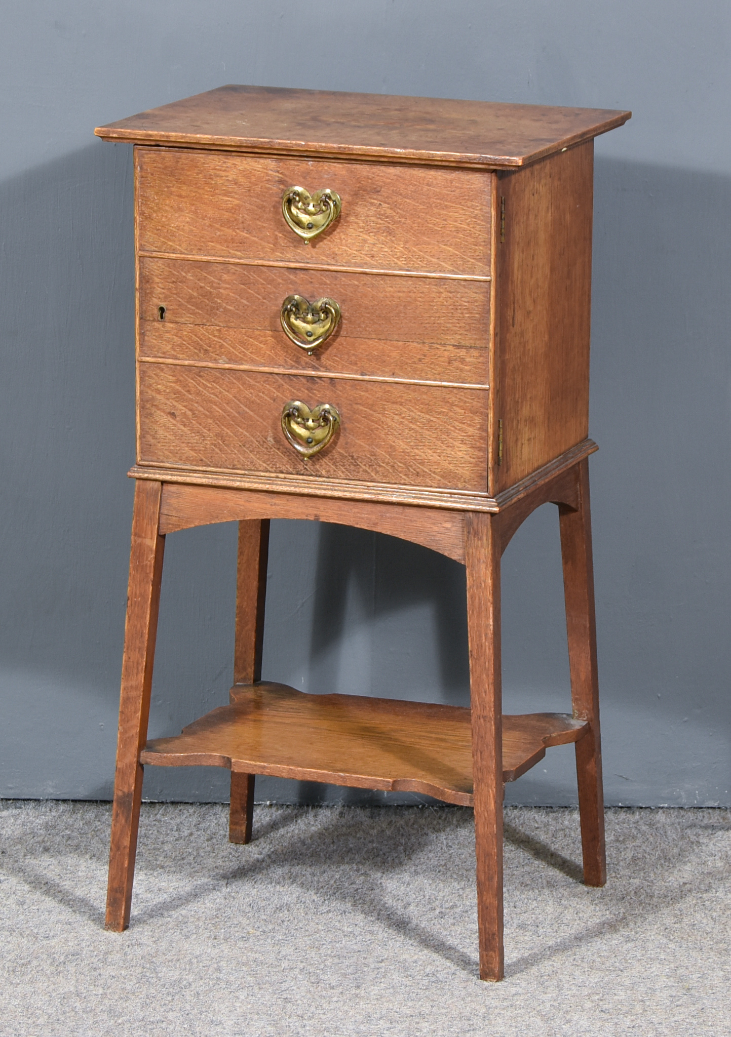 A Late Victorian Oak Smoker's Cabinet in the Liberty's Manner, fitted one drawer and cupboard