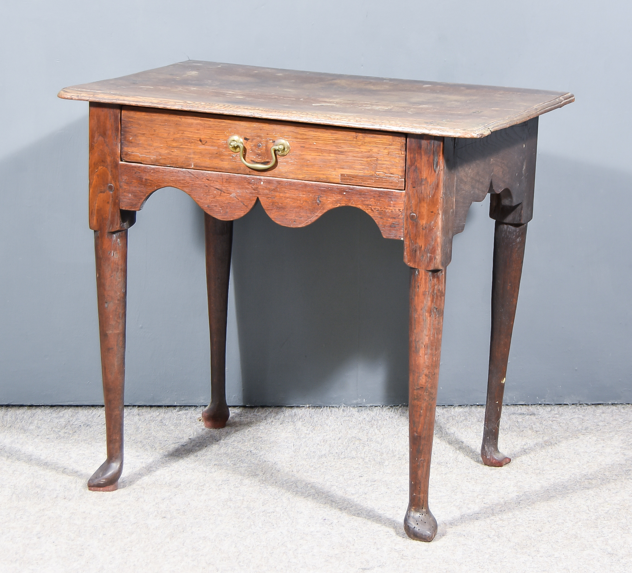 An 18th Century Oak Rectangular Side Table, with moulded edge and rounded front corners to top,