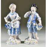 A Pair of Meissen Porcelain Figures, Late 19th Century, of children dressed as gardeners, the boy