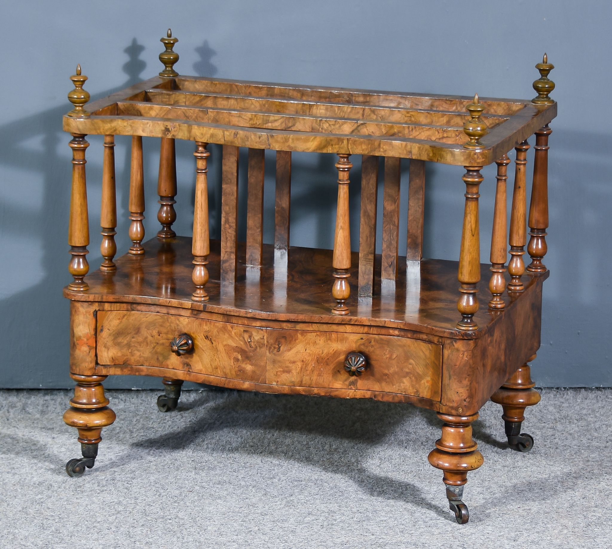 A Victorian Figured Walnut Serpentine-Fronted Three Division Canterbury, with slender turned